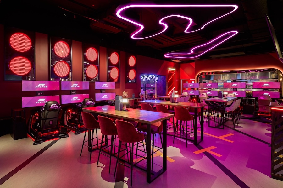 A futuristic racing arcade in Washington, DC, featuring neon lighting, F1-inspired decor and immersive gaming stations.