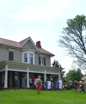 Picture of Frederick Douglass's house with people out front